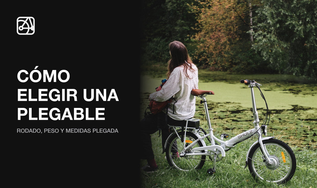Bicicleta plegable SHULZ blanca junto a un estanque, con el título «Cómo elegir una plegable»